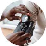 Woman getting a blood pressure test at a GP surgery