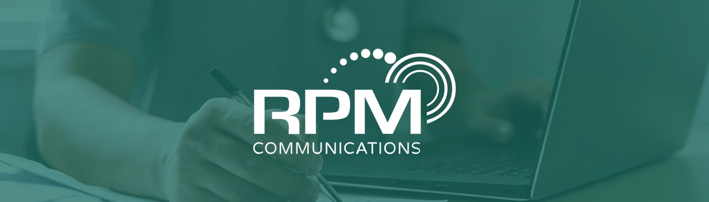 RPM Communications logo overlaid on person typing on laptop